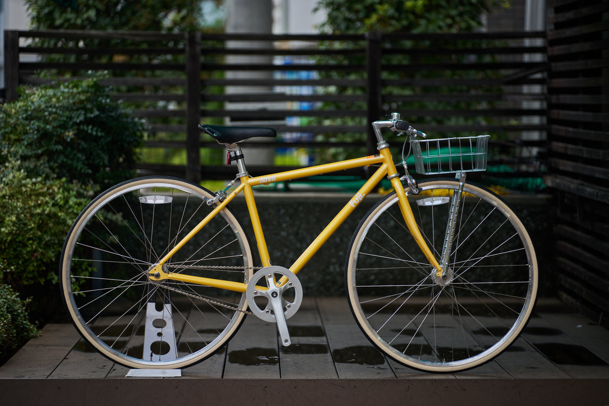 真横から見た自転車（黄）